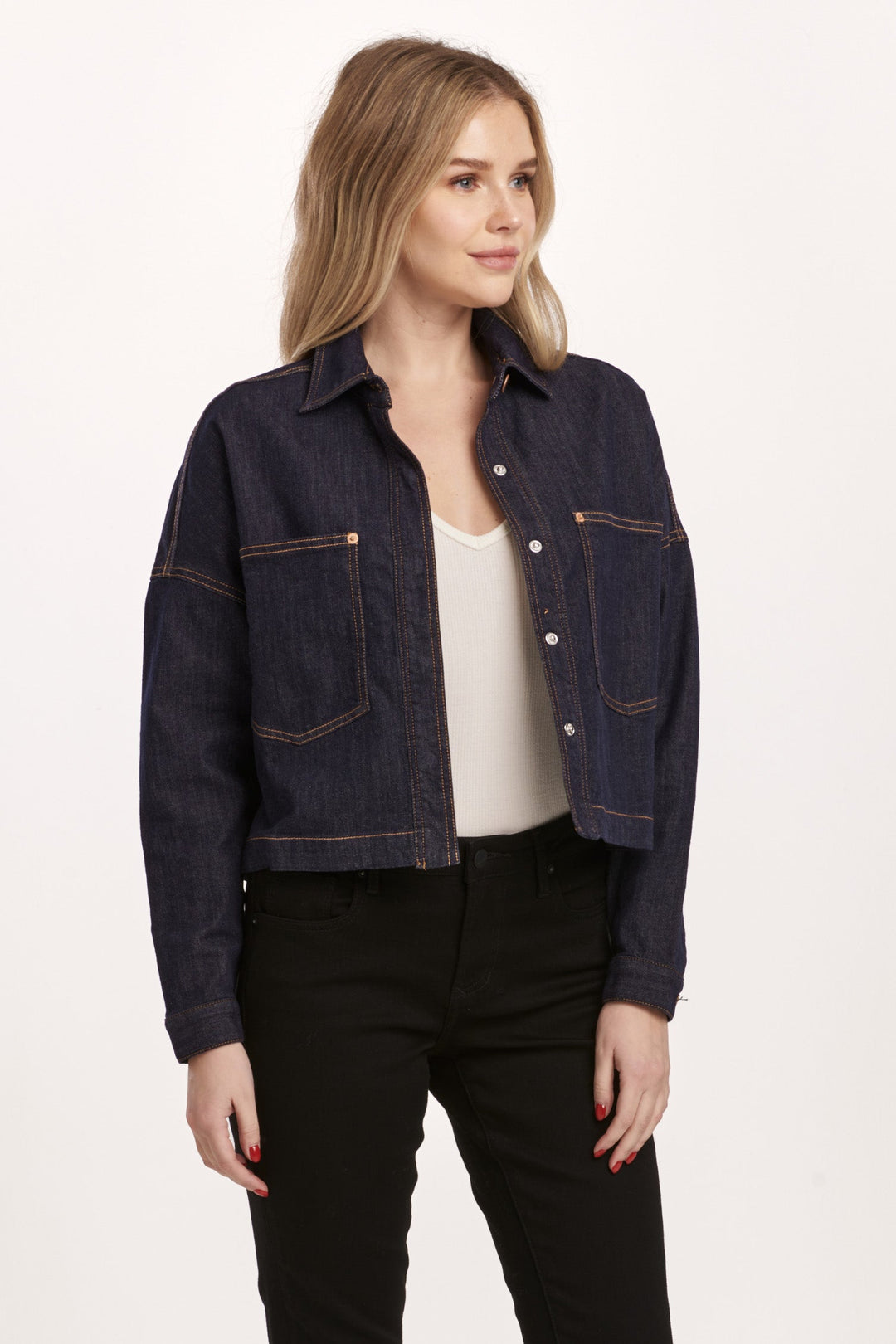 image of a female model wearing a GINA CROPPED DENIM SHIRT JACKET DARK DENIM DEAR JOHN DENIM 