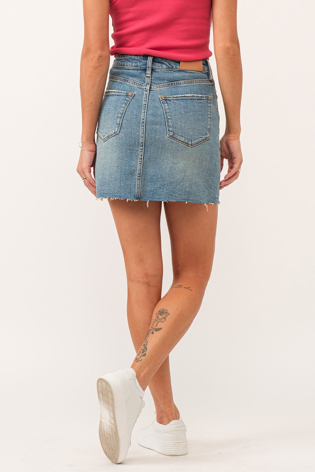 image of a female model wearing a QUINN SUPER HIGH RISE SKIRT BRIDGEPORT DEAR JOHN DENIM 