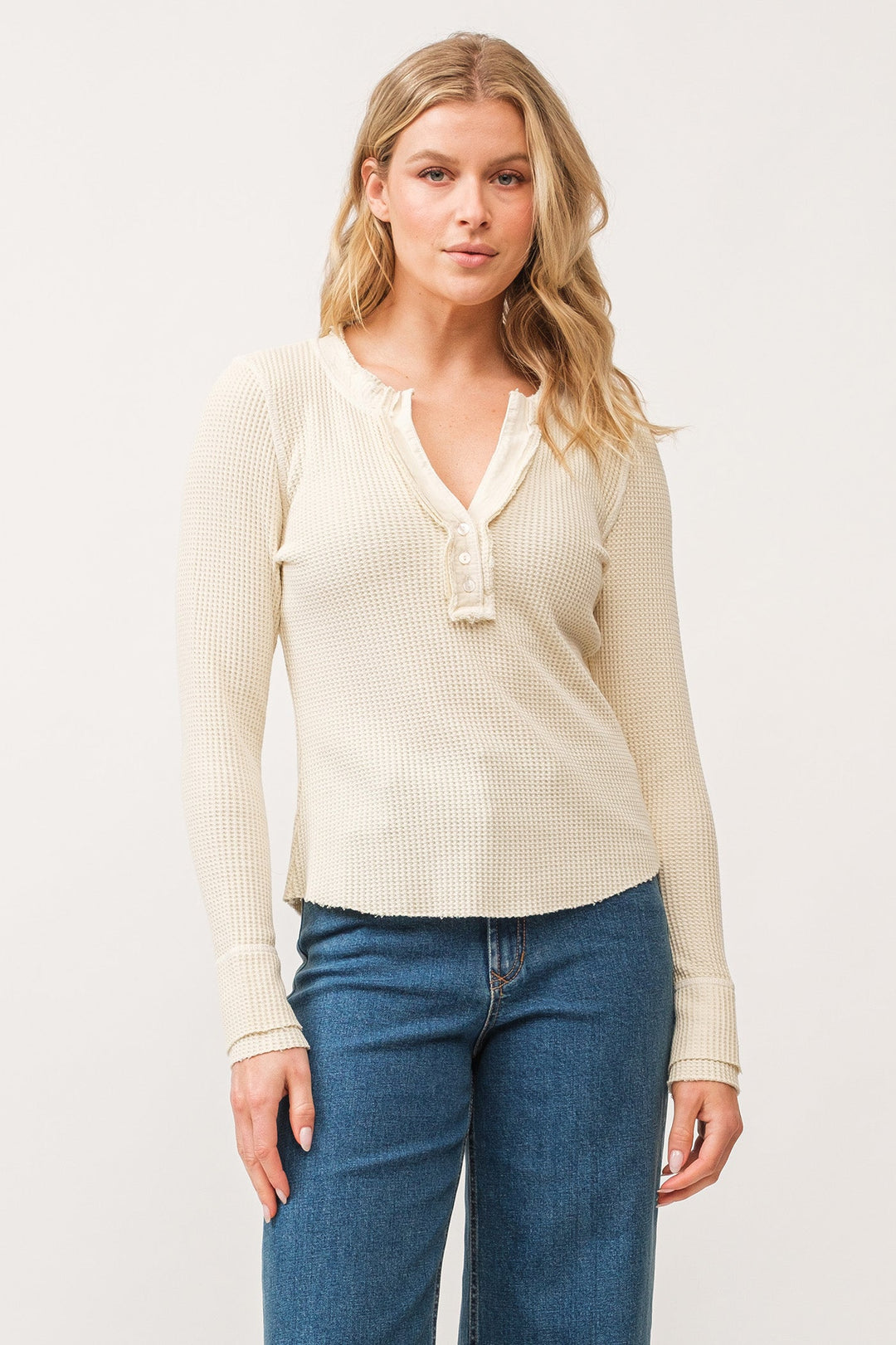 image of a female model wearing a LUNA V-NECK LONG SLEEVE FITTED TOP ANTIQUE WHITE DEAR JOHN DENIM 