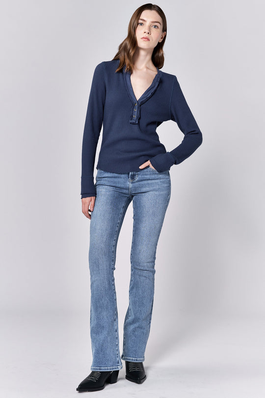 image of a female model wearing a LUNA V-NECK LONG SLEEVE FITTED TOP BLACK IRIS DEAR JOHN DENIM 