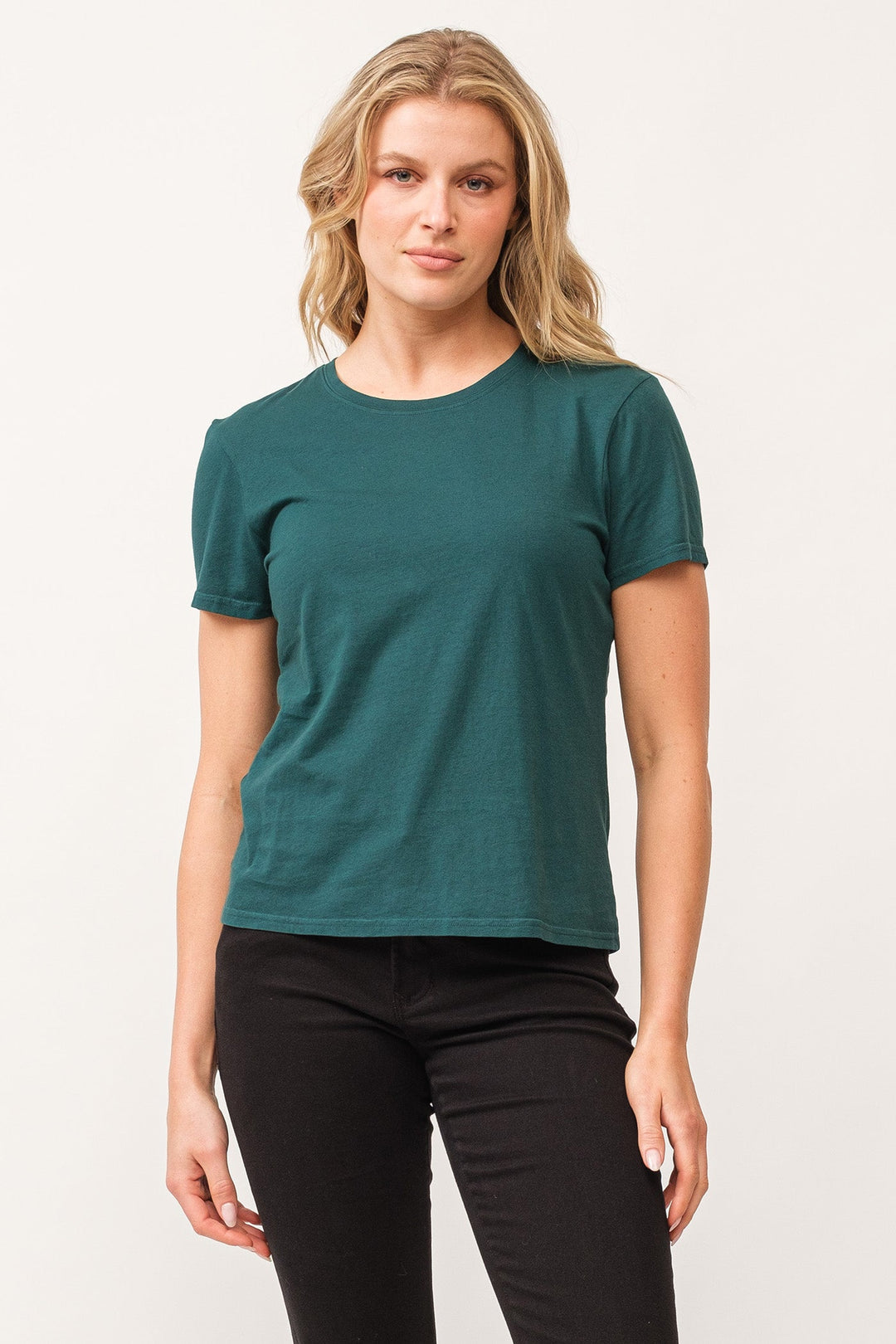 image of a female model wearing a UNITY CREW NECK SHORT SLEEVE RELAXED FIT TOP DEEP TEAL DEAR JOHN DENIM 