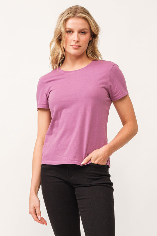 image of a female model wearing a UNITY CREW NECK SHORT SLEEVE RELAXED FIT TOP DAHLIA MAUVE DEAR JOHN DENIM 