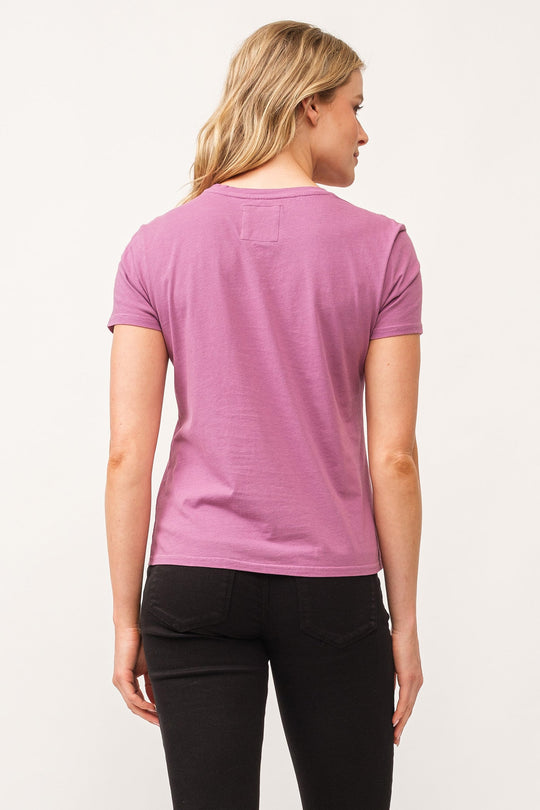 image of a female model wearing a UNITY CREW NECK SHORT SLEEVE RELAXED FIT TOP DAHLIA MAUVE DEAR JOHN DENIM 