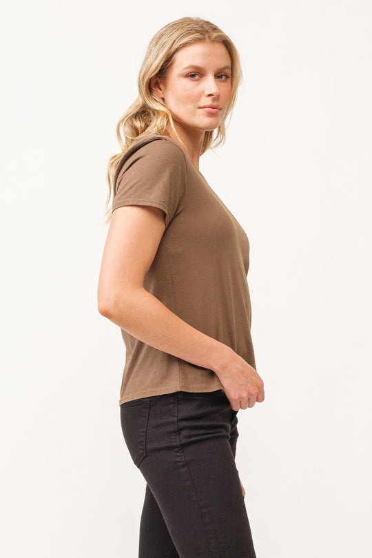 image of a female model wearing a UNITY CREW NECK SHORT SLEEVE RELAXED FIT TOP DARK OLIVE DEAR JOHN DENIM 