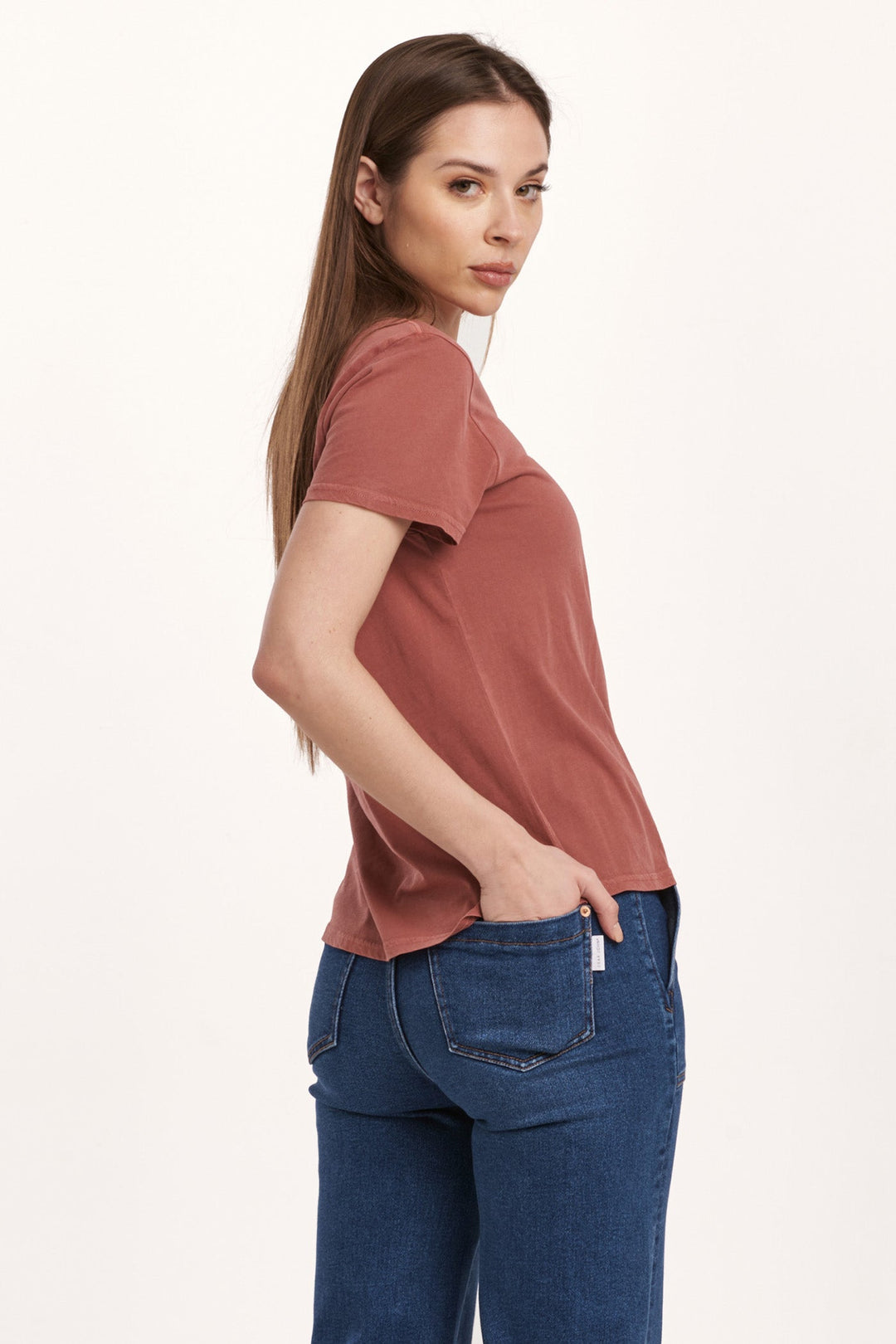 image of a female model wearing a UNITY SHORT SLEEVE JERSEY TEE INTENSE RUST DEAR JOHN DENIM 