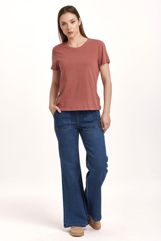 image of a female model wearing a UNITY SHORT SLEEVE JERSEY TEE INTENSE RUST DEAR JOHN DENIM 