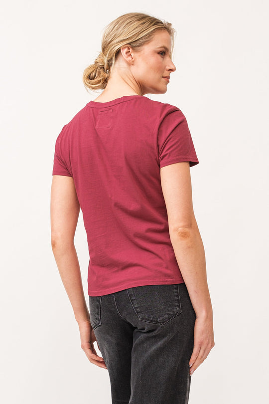 image of a female model wearing a UNITY CREW NECK SHORT SLEEVE RELAXED FIT TOP POMEGRANATE DEAR JOHN DENIM 