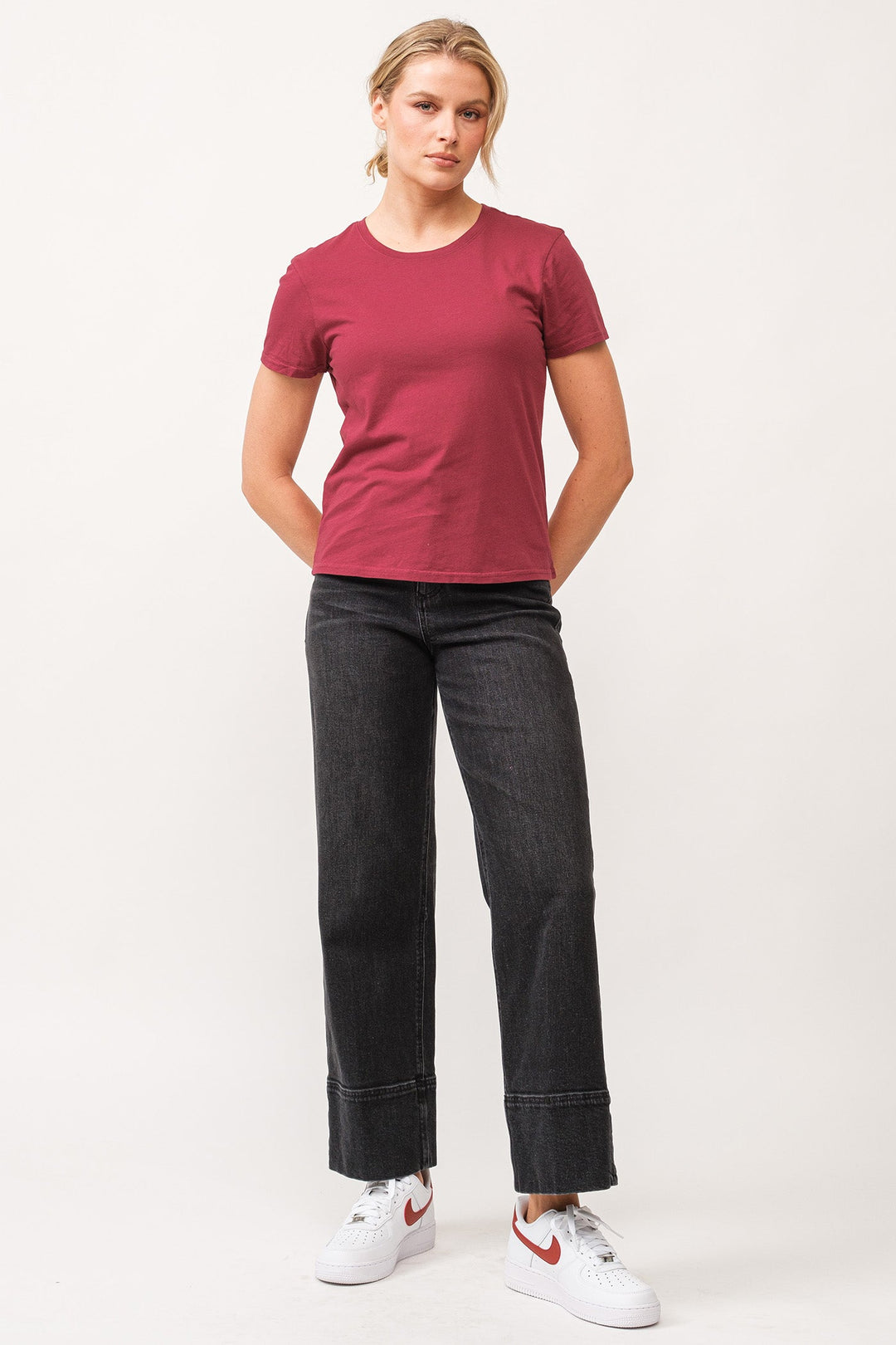 image of a female model wearing a UNITY CREW NECK SHORT SLEEVE RELAXED FIT TOP POMEGRANATE DEAR JOHN DENIM 