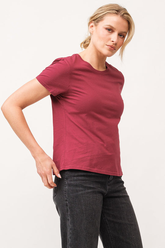 image of a female model wearing a UNITY CREW NECK SHORT SLEEVE RELAXED FIT TOP POMEGRANATE DEAR JOHN DENIM 