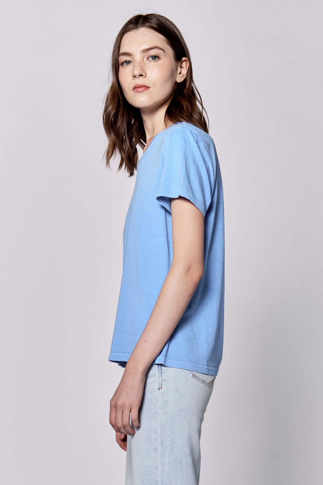 image of a female model wearing a UNITY CREW NECK SHORT SLEEVE RELAXED FIT TOP AZURE BLUE DEAR JOHN DENIM 