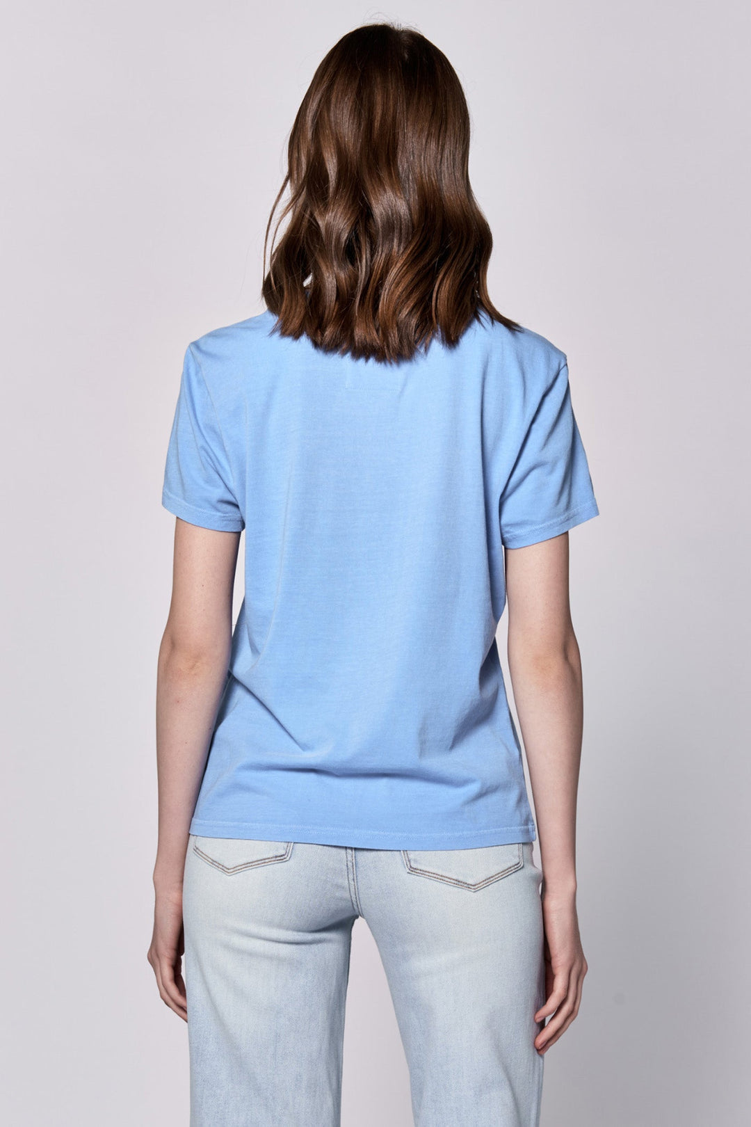 image of a female model wearing a UNITY CREW NECK SHORT SLEEVE RELAXED FIT TOP AZURE BLUE DEAR JOHN DENIM 