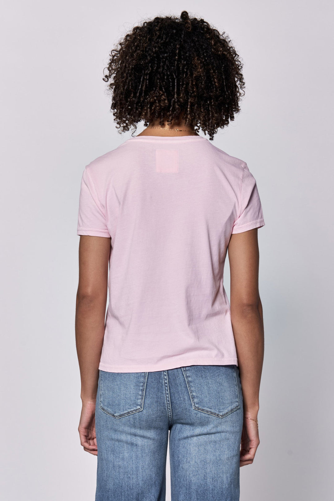 image of a female model wearing a UNITY CREW NECK SHORT SLEEVE RELAXED FIT TOP PINK A BOO DEAR JOHN DENIM 