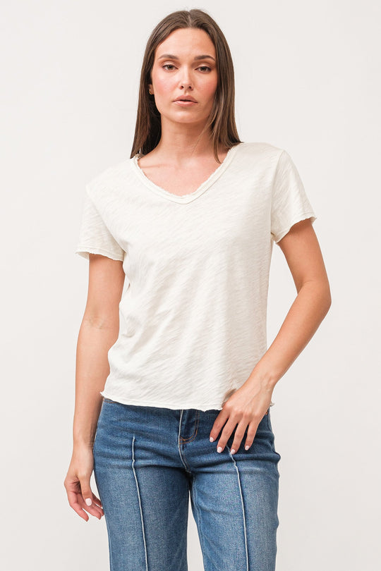 image of a female model wearing a VANYA V-NECK SHORT SLEEVE RELAXED FIT TOP ANTIQUE WHITE DEAR JOHN DENIM 