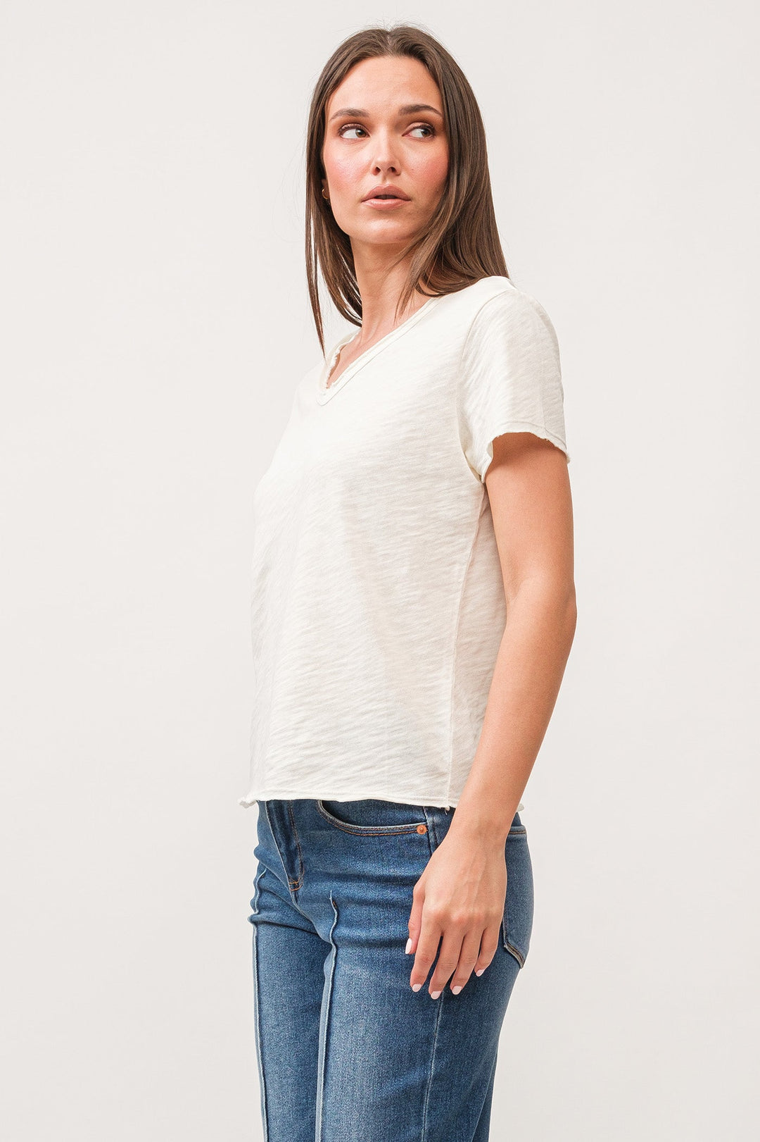 image of a female model wearing a VANYA V-NECK SHORT SLEEVE RELAXED FIT TOP ANTIQUE WHITE DEAR JOHN DENIM 