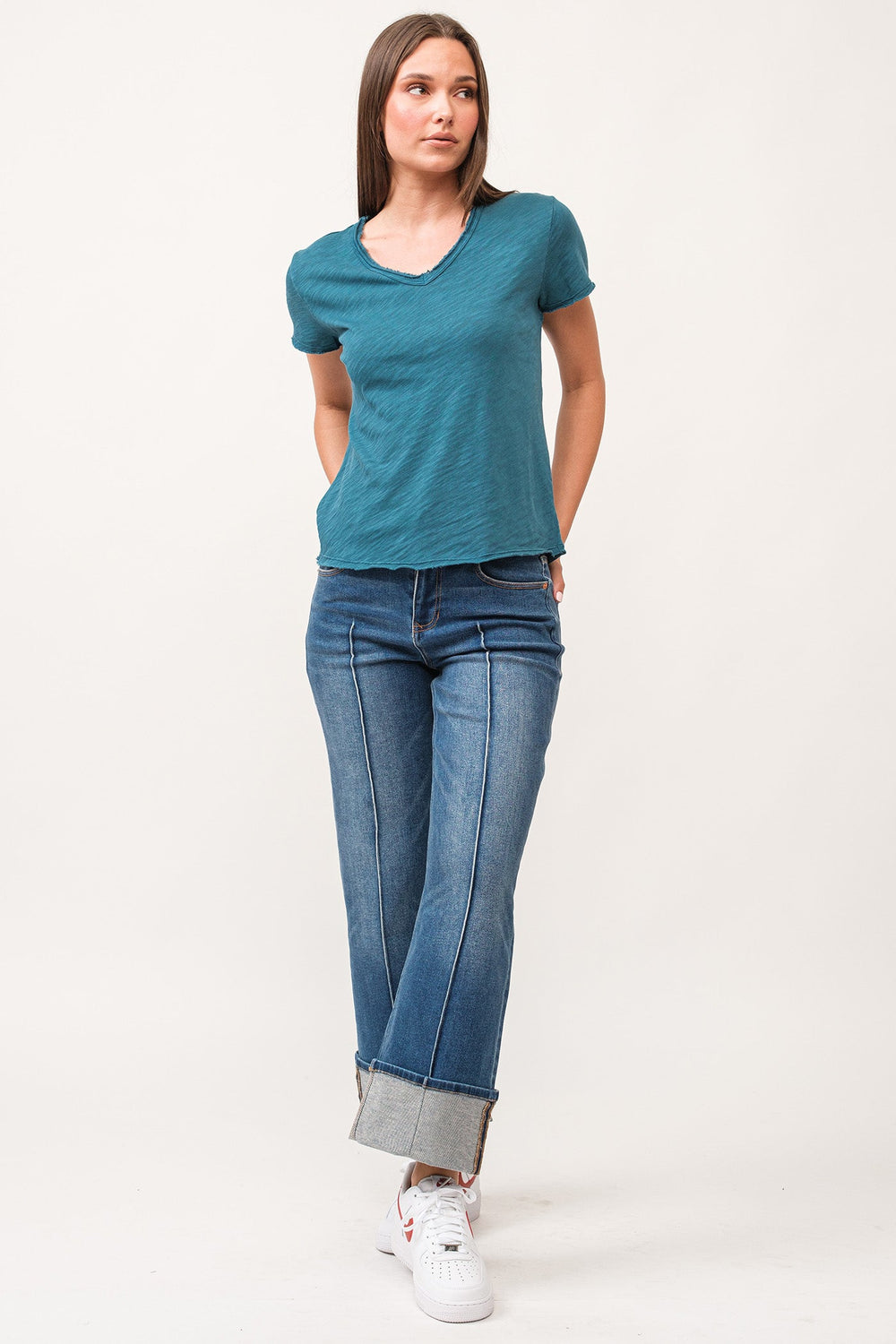 image of a female model wearing a VANYA V-NECK SHORT SLEEVE RELAXED FIT TOP DEEP TEAL DEAR JOHN DENIM 