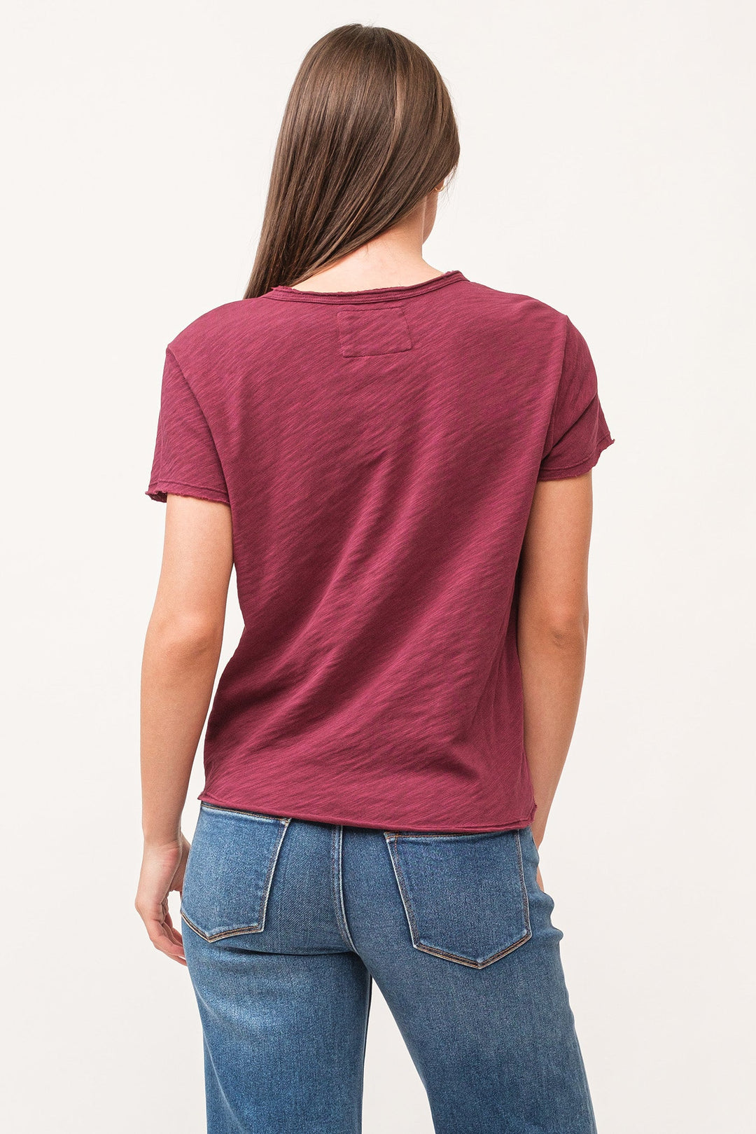 image of a female model wearing a VANYA V-NECK SHORT SLEEVE RELAXED FIT TOP POMEGRANATE DEAR JOHN DENIM 