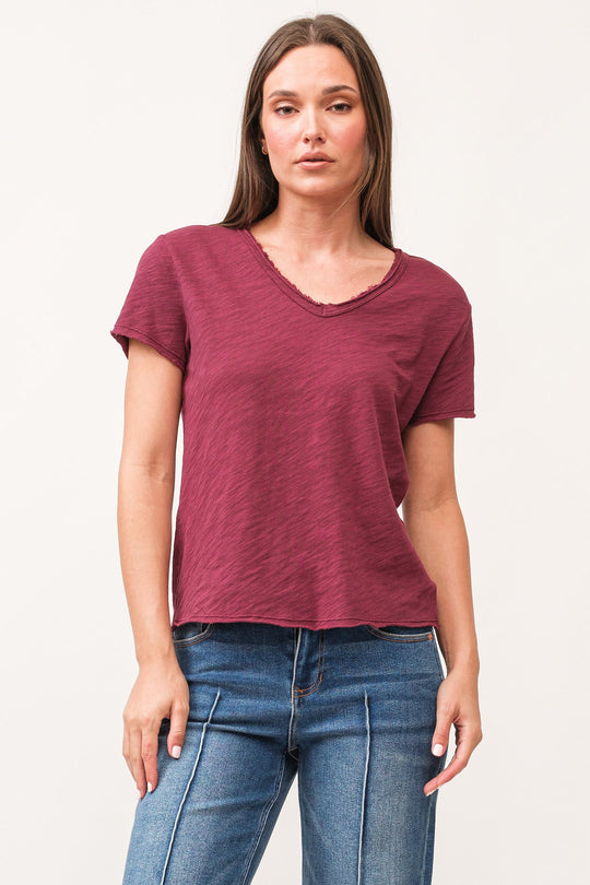 image of a female model wearing a VANYA V-NECK SHORT SLEEVE RELAXED FIT TOP POMEGRANATE DEAR JOHN DENIM 