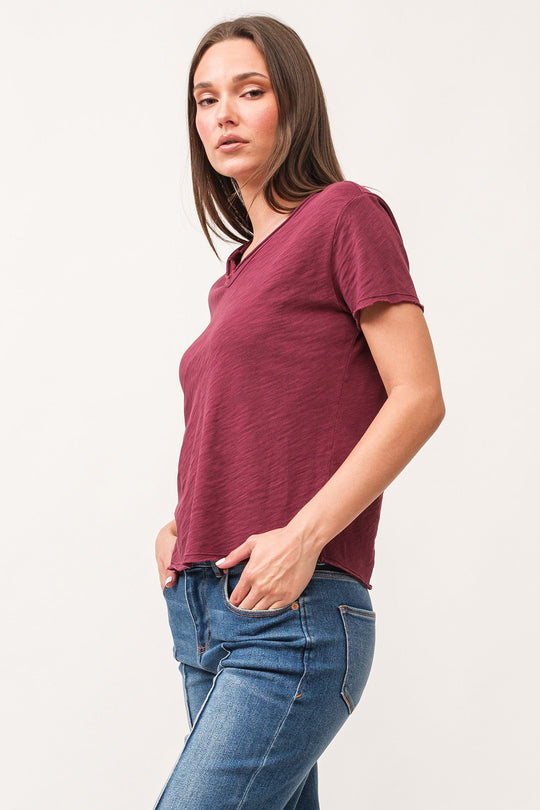 image of a female model wearing a VANYA V-NECK SHORT SLEEVE RELAXED FIT TOP POMEGRANATE DEAR JOHN DENIM 