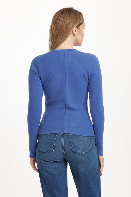 image of a female model wearing a MARLOWE V-NECK TOP BLUE LOLITE DEAR JOHN DENIM 