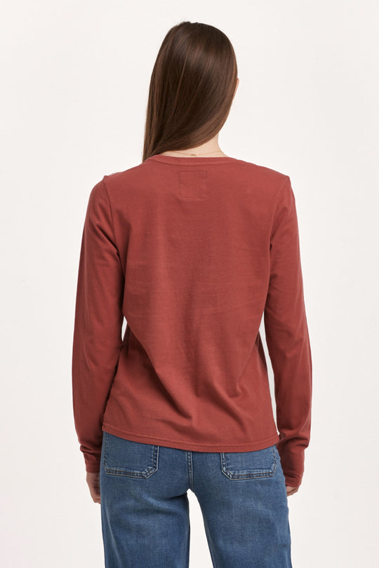 image of a female model wearing a KATHY LONG SLEEVE JERSEY TEE INTENSE RUST DEAR JOHN DENIM 