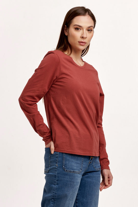 image of a female model wearing a KATHY LONG SLEEVE JERSEY TEE INTENSE RUST DEAR JOHN DENIM 