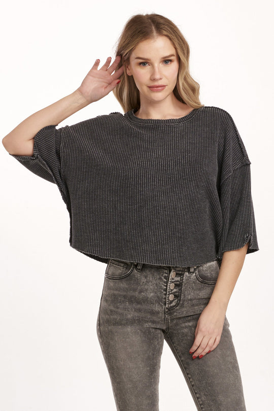 image of a female model wearing a AMIRA THERMAL WIDE SLEEVE TOP BLACK DEAR JOHN DENIM 