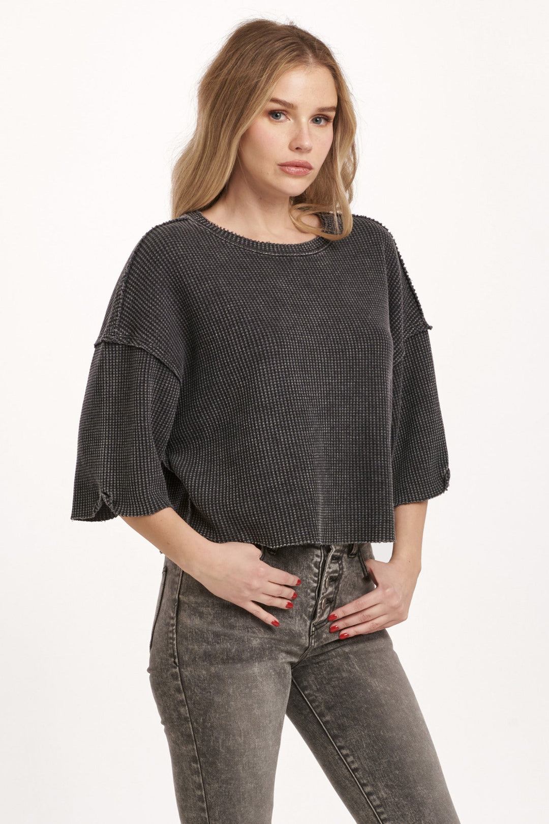 image of a female model wearing a AMIRA THERMAL WIDE SLEEVE TOP BLACK DEAR JOHN DENIM 