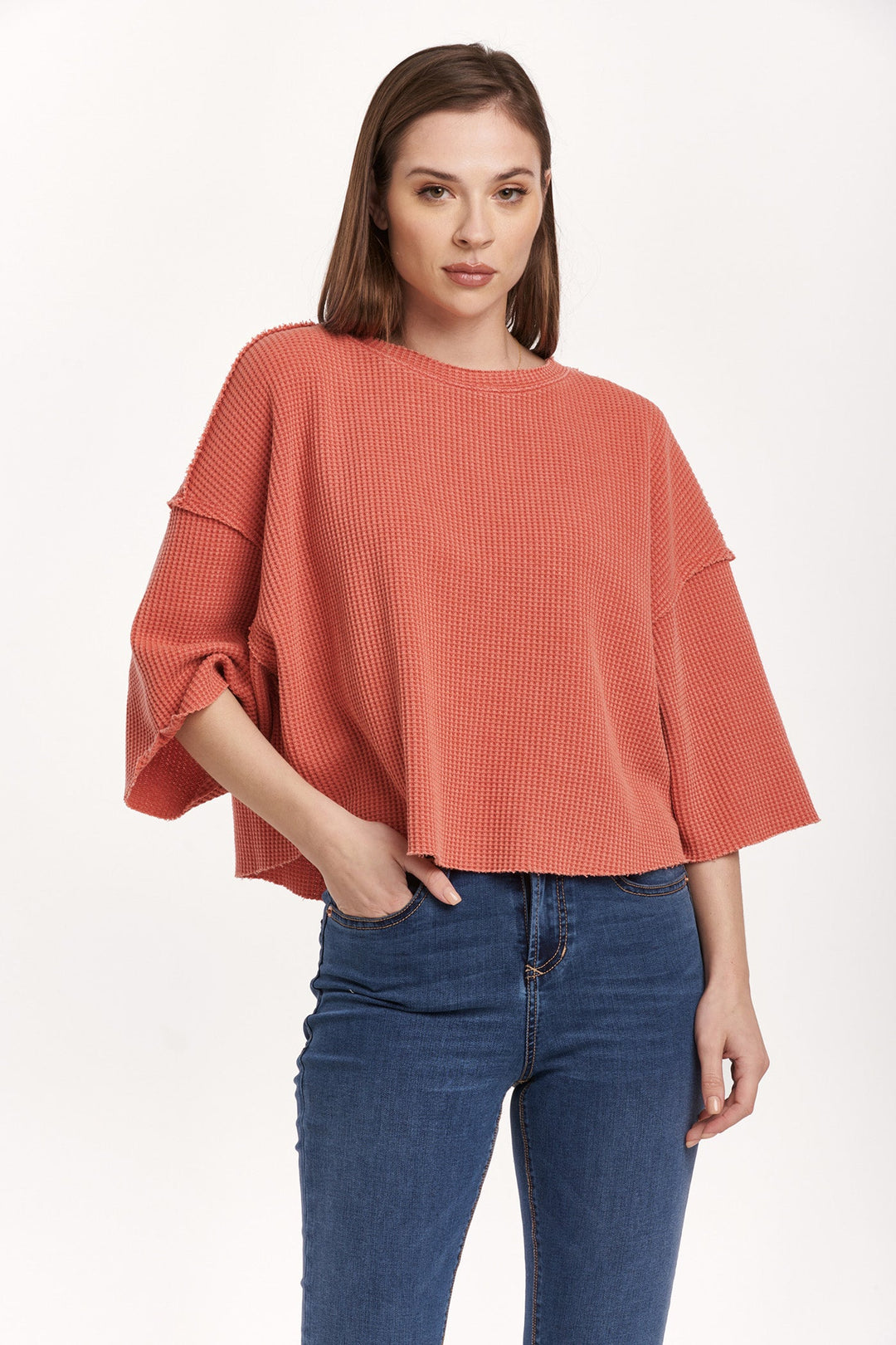 image of a female model wearing a AMIRA THERMAL WIDE SLEEVE TOP CRIMSON DEAR JOHN DENIM 