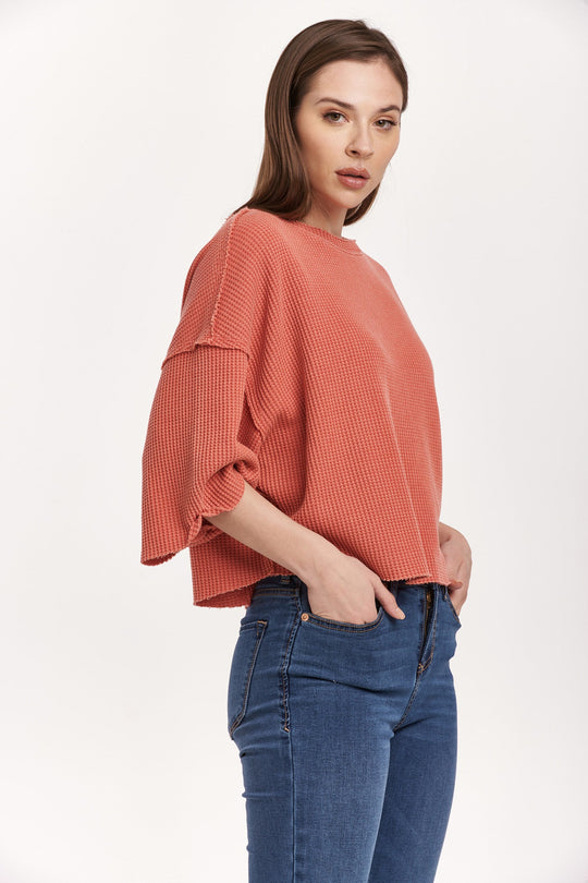 image of a female model wearing a AMIRA THERMAL WIDE SLEEVE TOP CRIMSON DEAR JOHN DENIM 