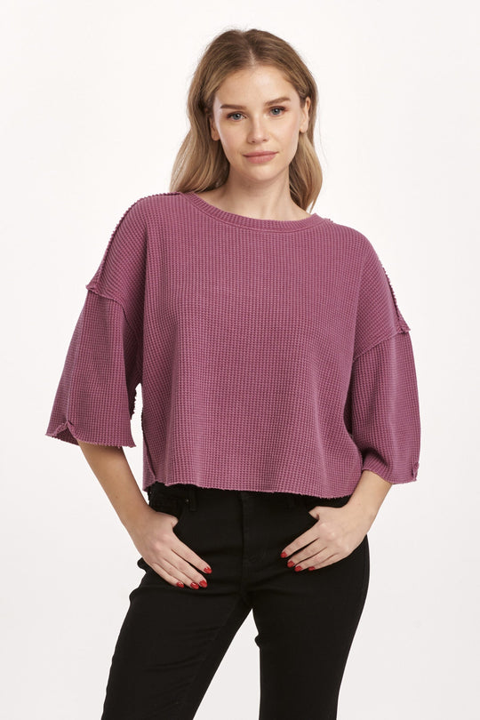 image of a female model wearing a AMIRA THERMAL WIDE SLEEVE TOP PLUM BERRY DEAR JOHN DENIM 