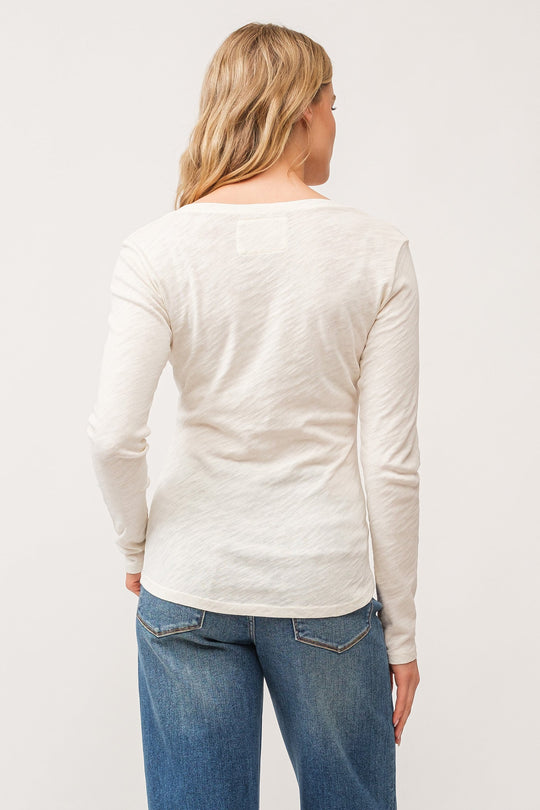 image of a female model wearing a ALINA V-NECK LONG SLEEVE CLASSIC FIT TOP ANTIQUE WHITE DEAR JOHN DENIM 