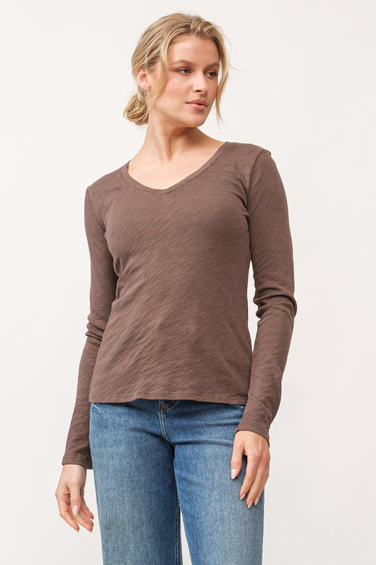 image of a female model wearing a ALINA V-NECK LONG SLEEVE CLASSIC FIT TOP DARK OLIVE DEAR JOHN DENIM 