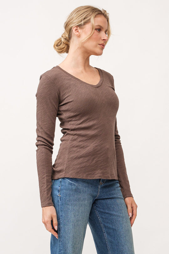 image of a female model wearing a ALINA V-NECK LONG SLEEVE CLASSIC FIT TOP DARK OLIVE DEAR JOHN DENIM 