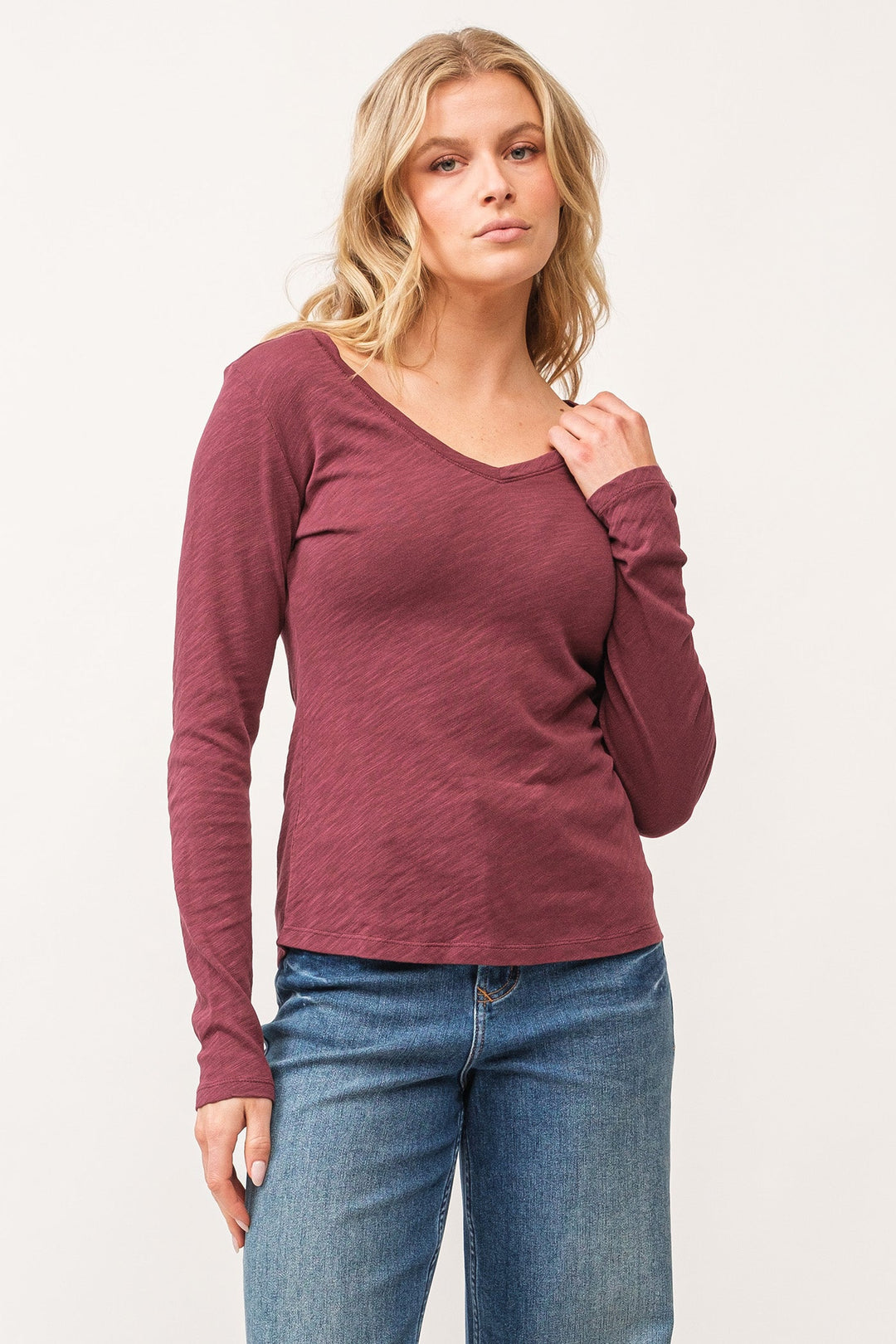 image of a female model wearing a ALINA V-NECK LONG SLEEVE CLASSIC FIT TOP POMEGRANATE DEAR JOHN DENIM 