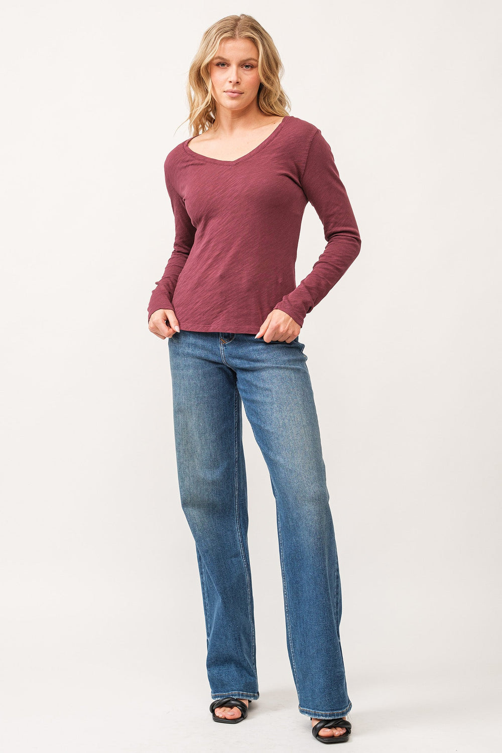 image of a female model wearing a ALINA V-NECK LONG SLEEVE CLASSIC FIT TOP POMEGRANATE DEAR JOHN DENIM 