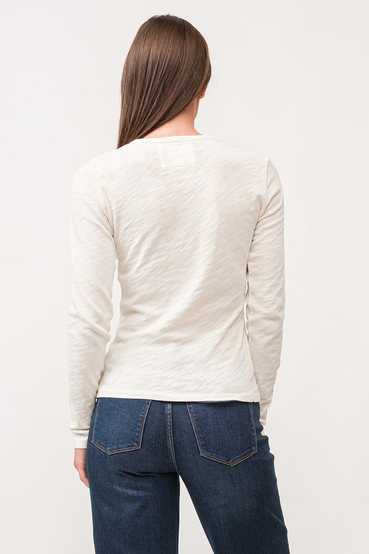 image of a female model wearing a NINA CREW NECK LONG SLEEVE CLASSIC FIT TOP ANTIQUE WHITE DEAR JOHN DENIM 