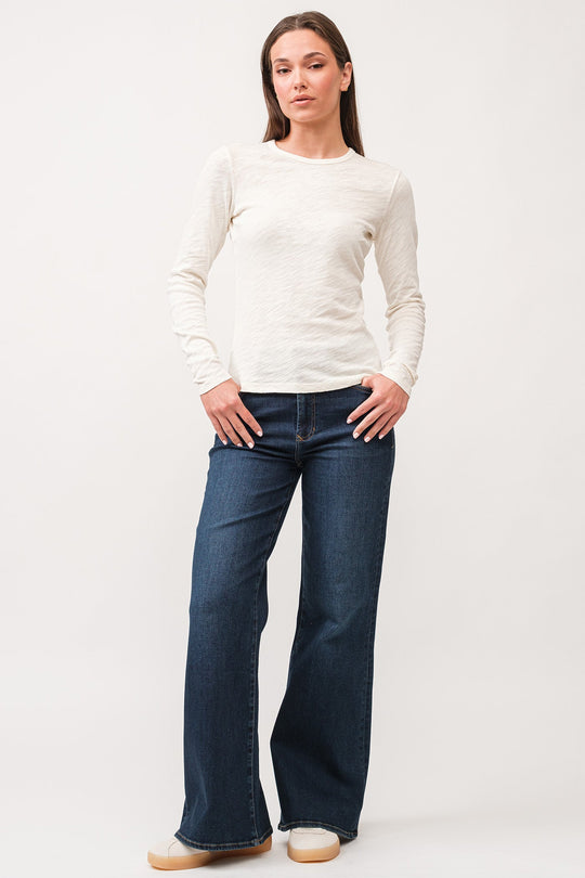 image of a female model wearing a NINA CREW NECK LONG SLEEVE CLASSIC FIT TOP ANTIQUE WHITE DEAR JOHN DENIM 