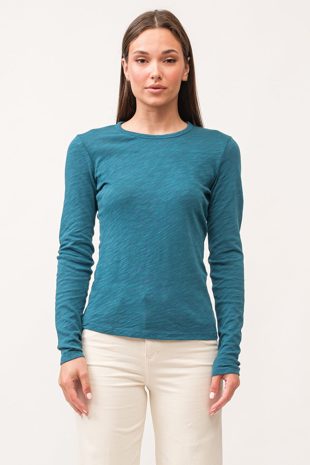 image of a female model wearing a NINA CREW NECK LONG SLEEVE CLASSIC FIT TOP DEEP TEAL DEAR JOHN DENIM 