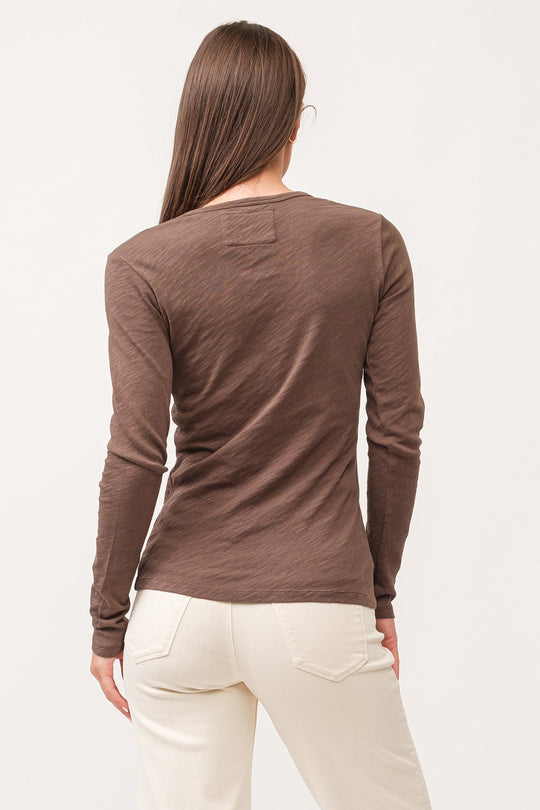 image of a female model wearing a NINA CREW NECK LONG SLEEVE CLASSIC FIT TOP DARK OLIVE DEAR JOHN DENIM 