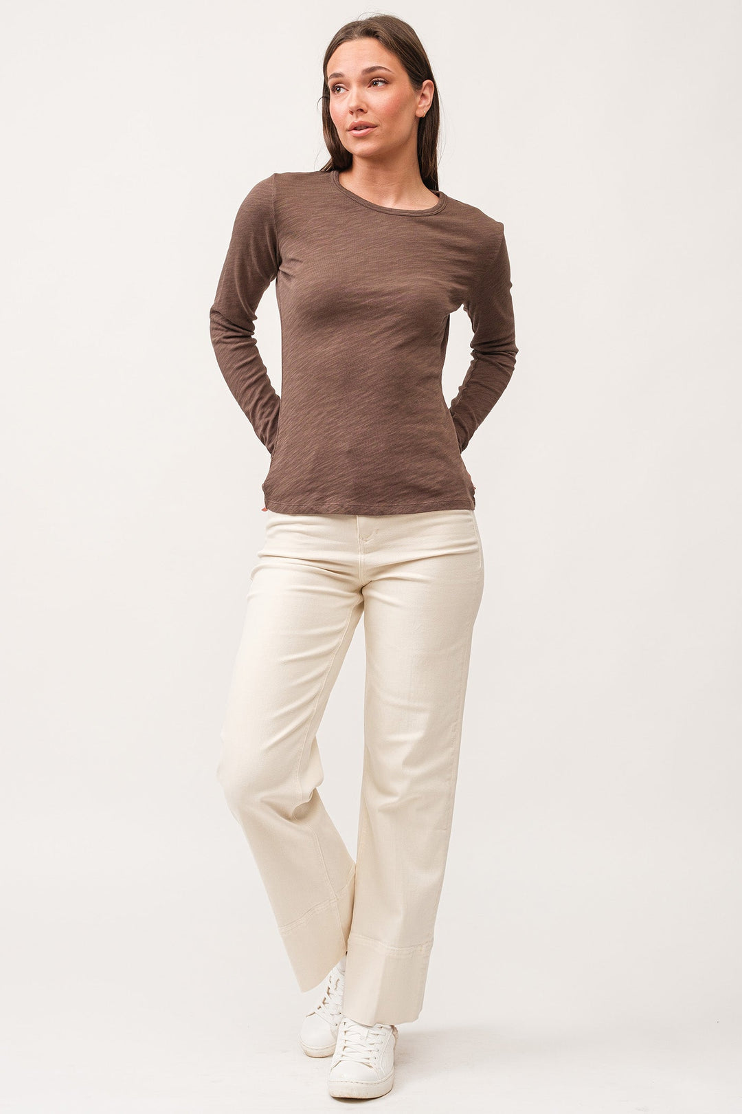 image of a female model wearing a NINA CREW NECK LONG SLEEVE CLASSIC FIT TOP DARK OLIVE DEAR JOHN DENIM 