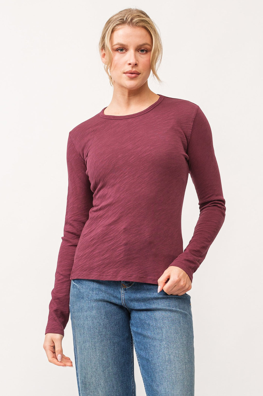 image of a female model wearing a NINA CREW NECK LONG SLEEVE CLASSIC FIT TOP POMEGRANATE DEAR JOHN DENIM 