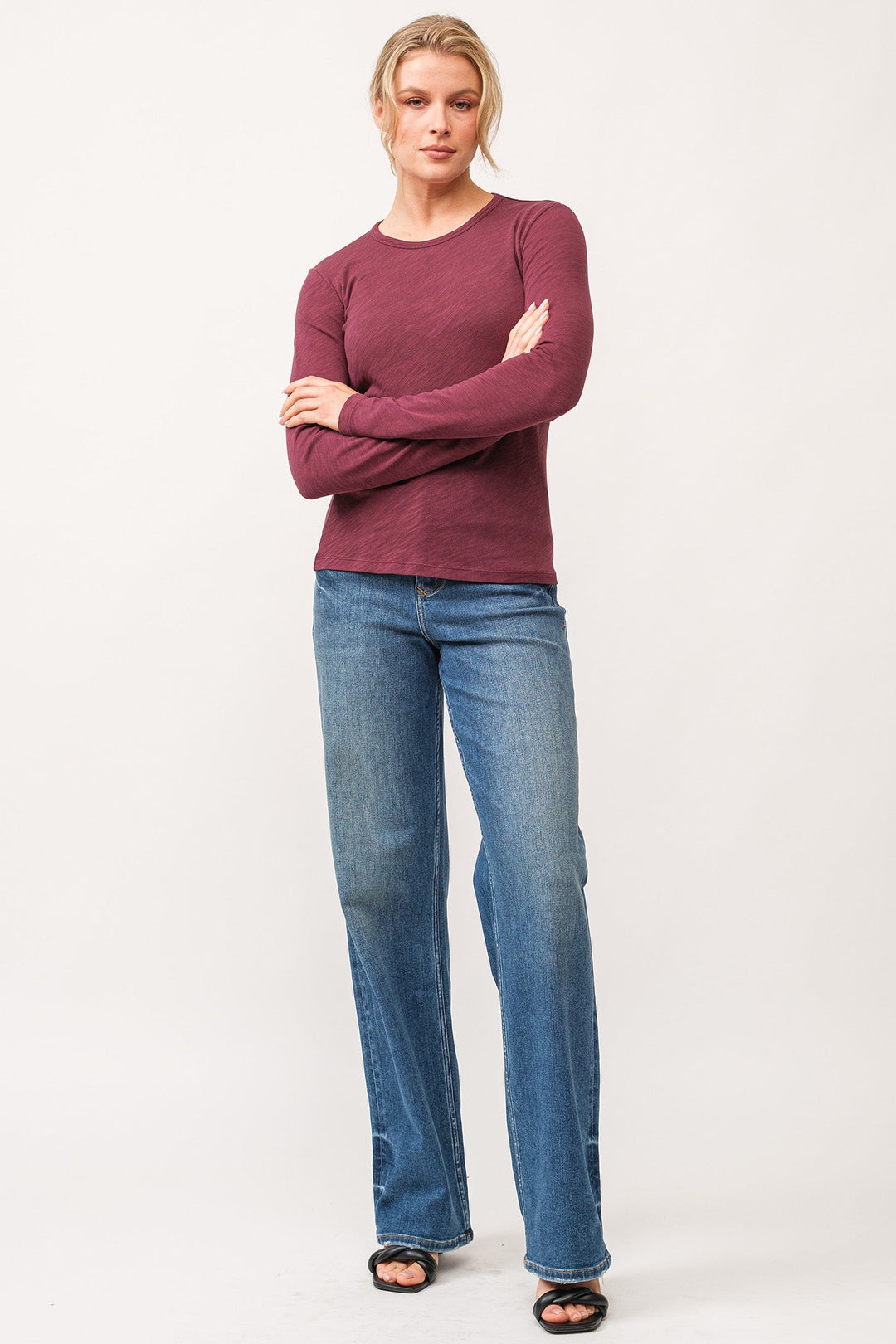 image of a female model wearing a NINA CREW NECK LONG SLEEVE CLASSIC FIT TOP POMEGRANATE DEAR JOHN DENIM 