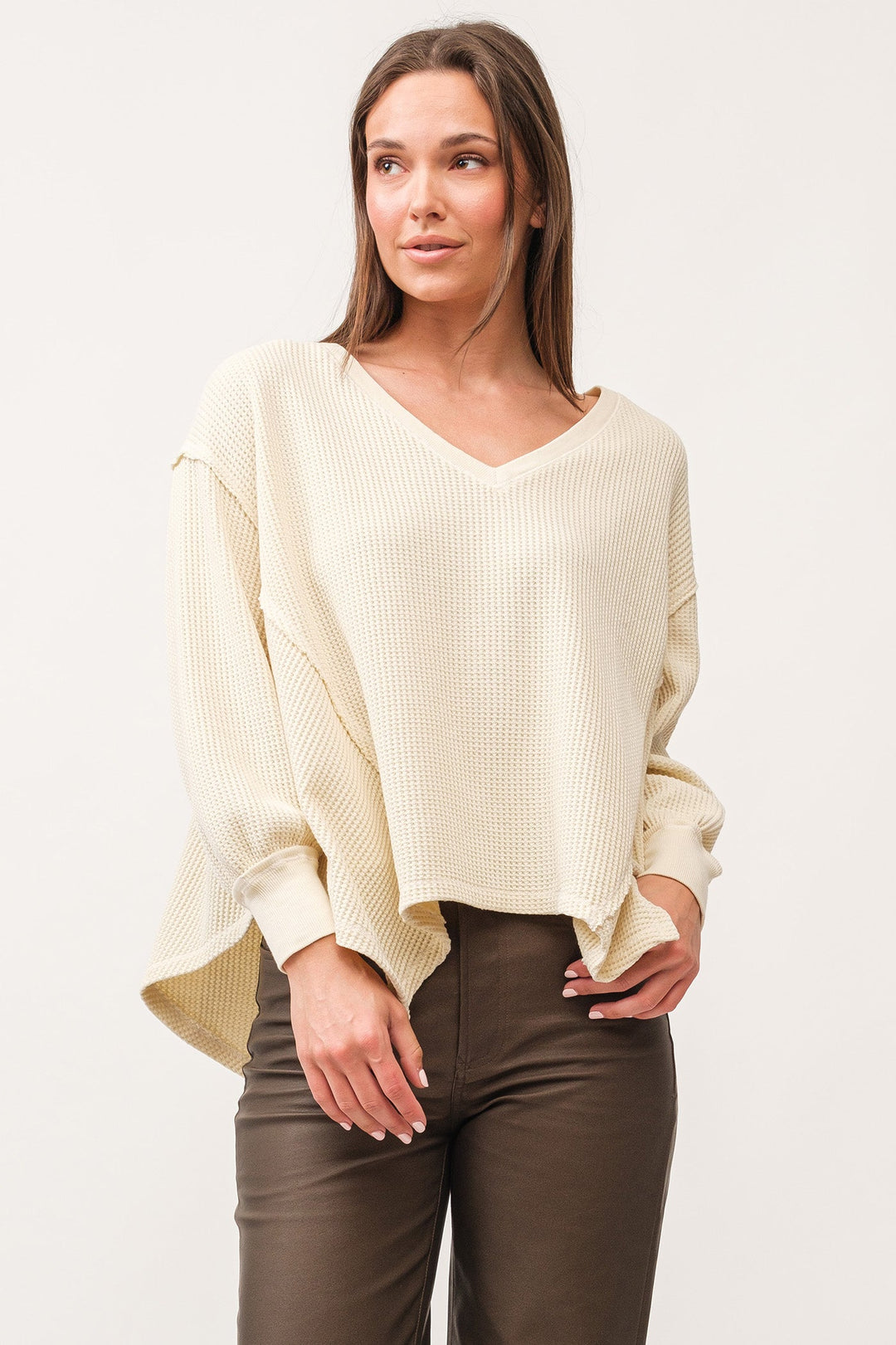 image of a female model wearing a MIRA V-NECK OVERSIZED LONG SLEEVE TOP ANTIQUE WHITE DEAR JOHN DENIM 