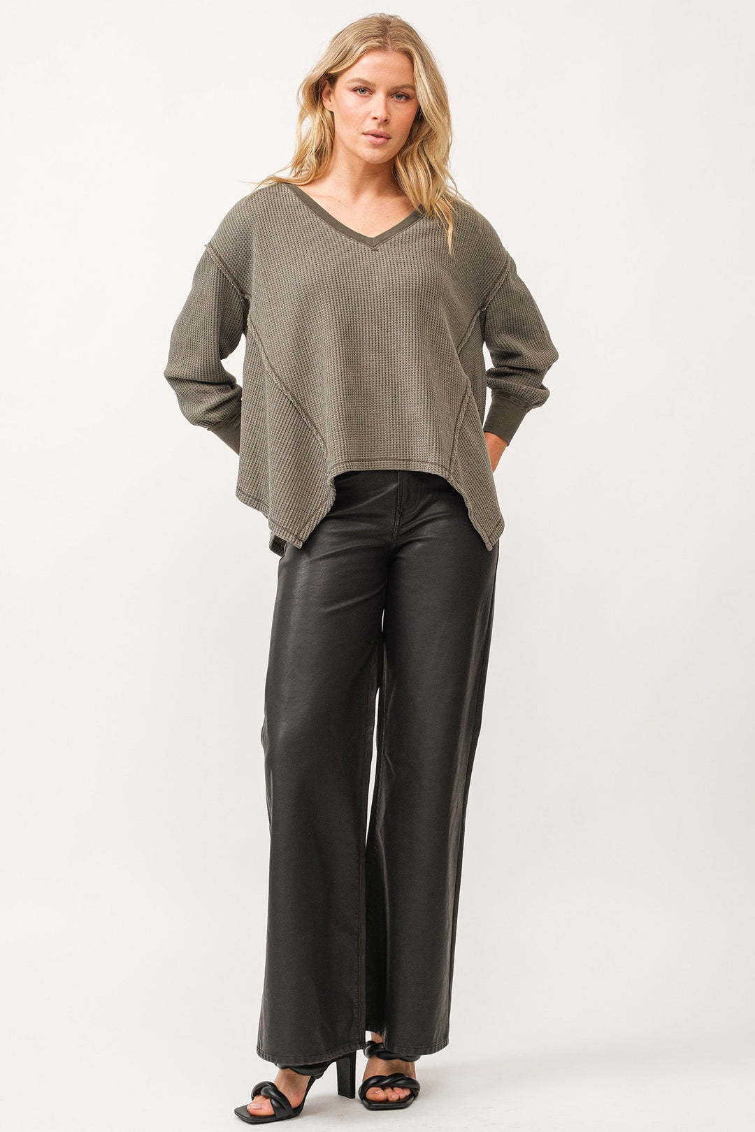 image of a female model wearing a MIRA V-NECK OVERSIZED LONG SLEEVE TOP DARK OLIVE DEAR JOHN DENIM 