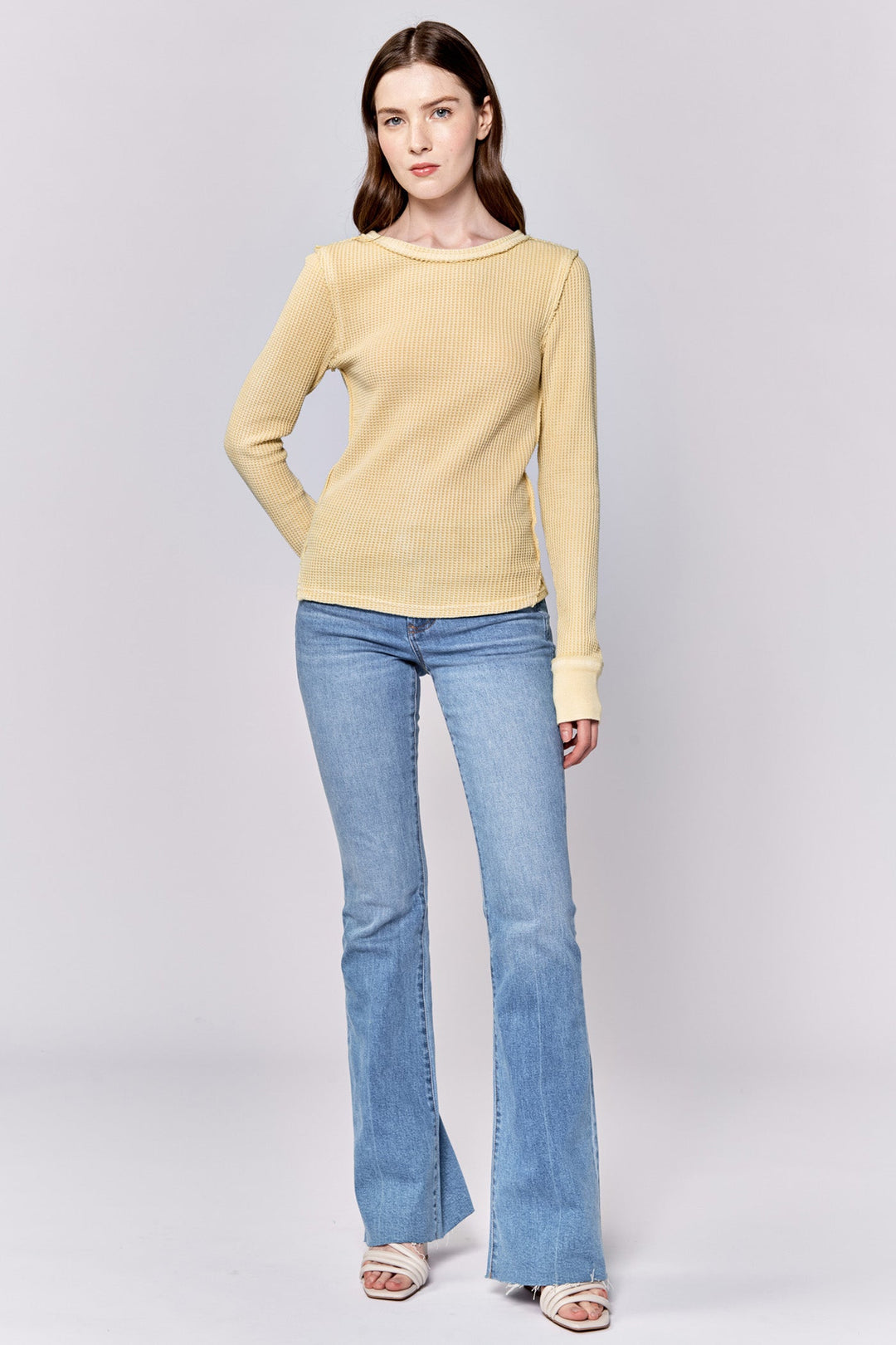 image of a female model wearing a ANIA THERMAL LONG SLEEVE FITTED TOP PALE BANANA DEAR JOHN DENIM 