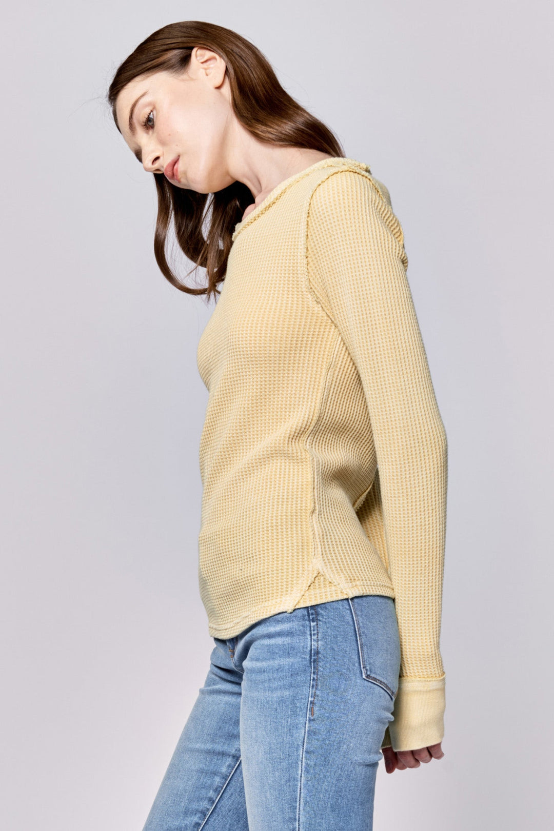 image of a female model wearing a ANIA THERMAL LONG SLEEVE FITTED TOP PALE BANANA DEAR JOHN DENIM 