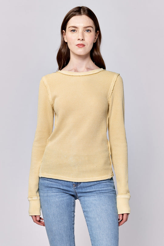 image of a female model wearing a ANIA THERMAL LONG SLEEVE FITTED TOP PALE BANANA DEAR JOHN DENIM 