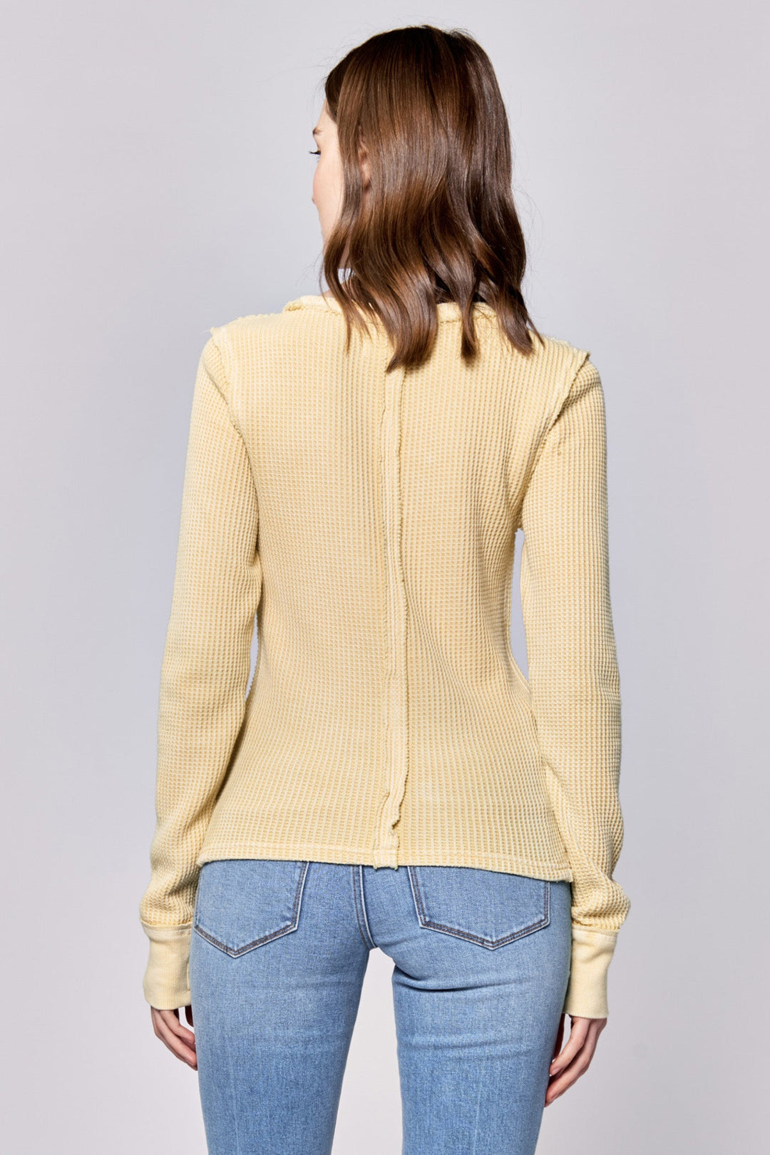 image of a female model wearing a ANIA THERMAL LONG SLEEVE FITTED TOP PALE BANANA DEAR JOHN DENIM 