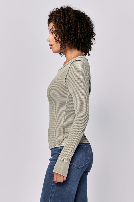 image of a female model wearing a ANIA THERMAL LONG SLEEVE FITTED TOP VETIVER DEAR JOHN DENIM 