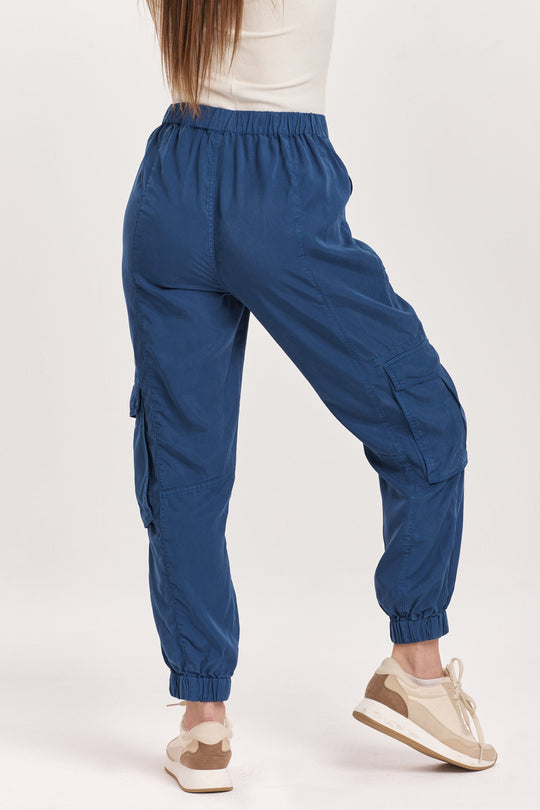 image of a female model wearing a SANDY SUPER HIGH RISE ANKLE TROUSER PANTS BLUEBERRY DEAR JOHN DENIM 